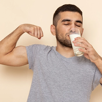 Man drinking almond milk to increase testosterone