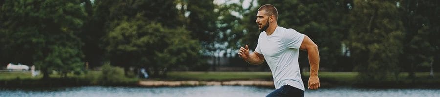 A person jogging outside to improve the immune system