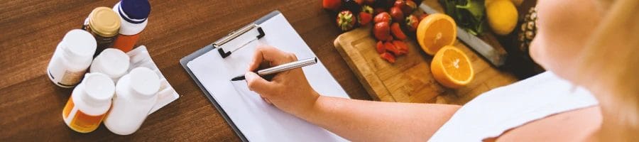 A dietician writing down a guide for buying nootropics