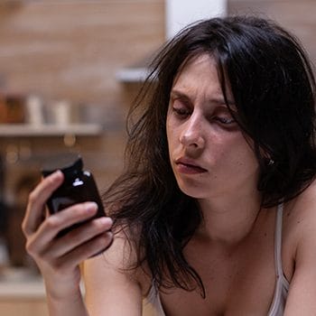 Haggard person reading nootropics supplement facts