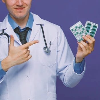 A doctor holding pills that increase low testosterone levels