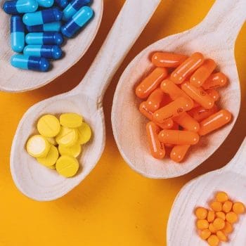 A picture of Provasil and competition pills on wooden spoons