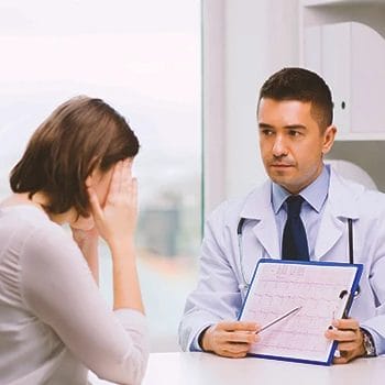 A doctor explaining to a woman the standard testosterone level
