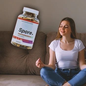 A woman doing yoga indoors with spore focus