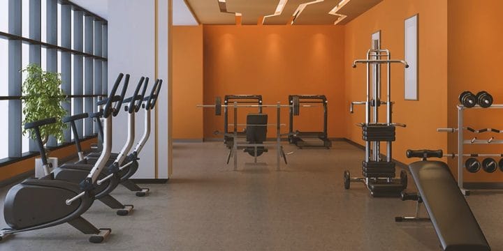 A home gym filled with gym equipment for a typical training session
