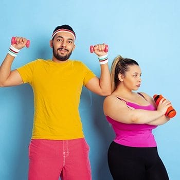 Couple about to perform their own workouts