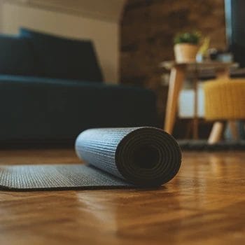 A roll of gym flooring indoors on the ground