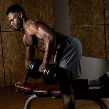An African doing dumbbell row