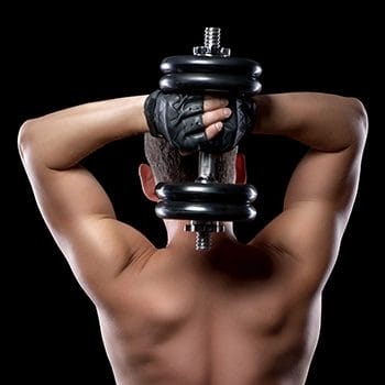 Holding dumbbell behind his back for rotation