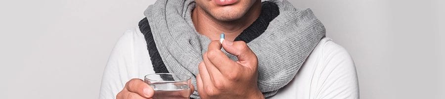 Holding white pill close up image