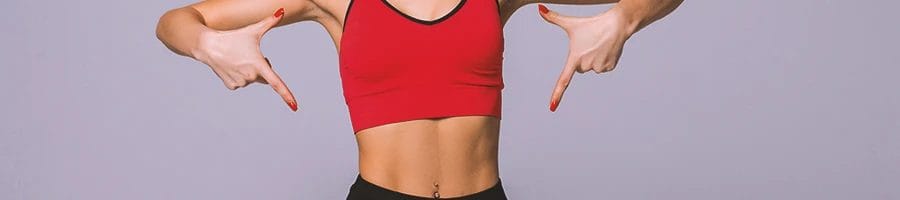 A person pointing to her psoas muscle