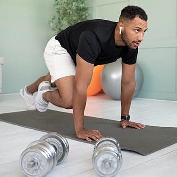 Man doing exercises on the yoga mat