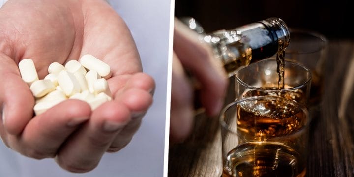 Holding pills and pouring alcohol on glass
