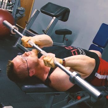 A person doing a JM press