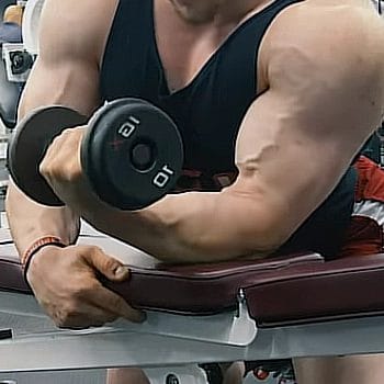 Forearm resting on a bench while doing wrist curls
