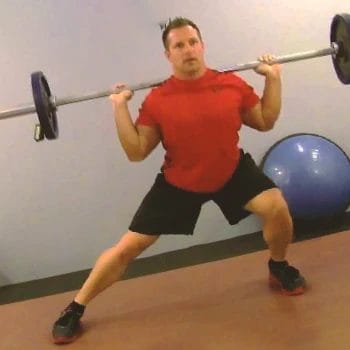 A person doing barbell side lunges