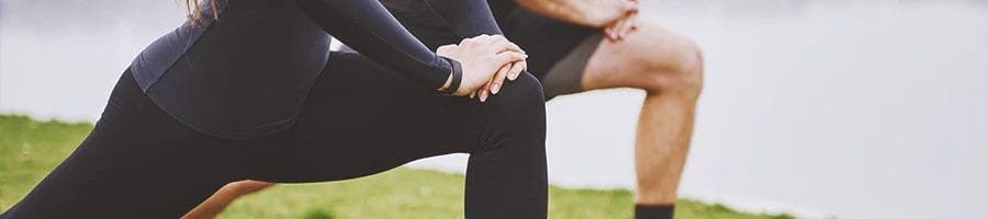 A couple doing isolation exercises at home
