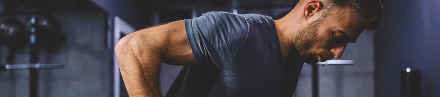 A person training his triceps in the gym