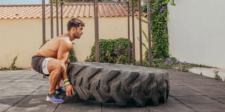Flipping a big tire strongman exercise