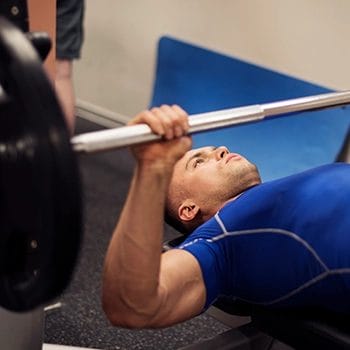 Doing bench press barbell workout