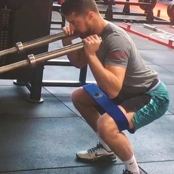 A person doing eccentric isometrics