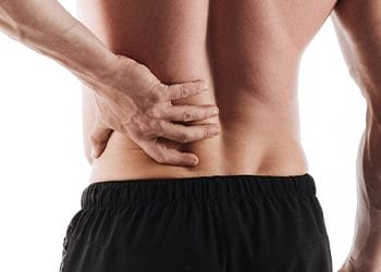 Man holding his back