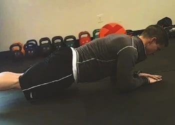 A person doing hardstyle plank