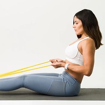 Using a resistance band to perform soleus seated stretch