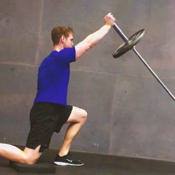 A person doing a landmine overhead press