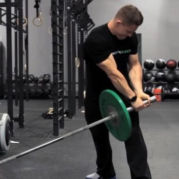 Performing landmine rotation inside the gym