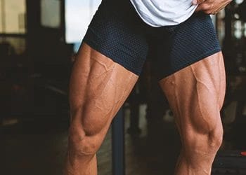 A person flexing his buff legs