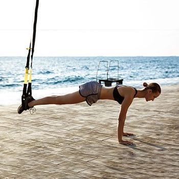 Doing suspended plank outdoors