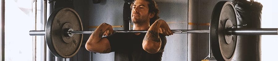 A person lifting up a barbell