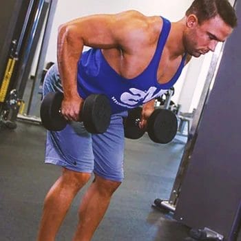 A strongman doing bent-over rows in the gym