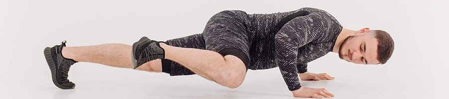 Performing side kicks while planking