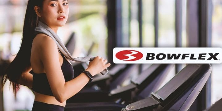 A woman working out on bowflex equipment