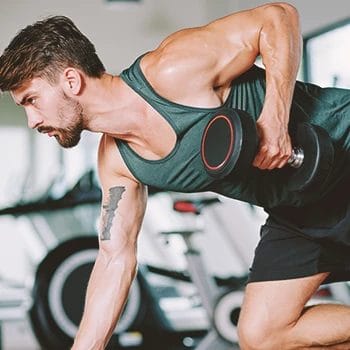 A buff male doing bicep workouts