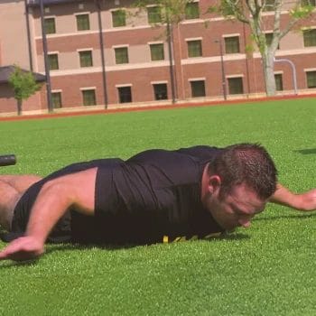 A person doing a hand release push up