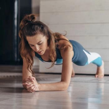 Woman doing push ups on the floor