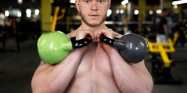Performing kettlebell arm workouts