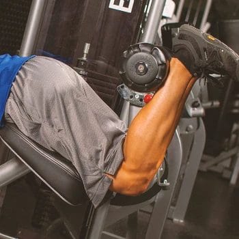 A person doing leg curls in the gym