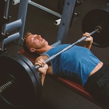 A person doing Old School Training Method for chest muscle