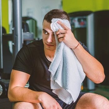 A person in the gym sweating