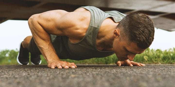 A person doing push ups outside