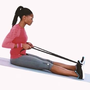 A woman doing resistance band assisted calf flexion