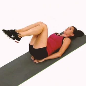 A woman doing reverse crunches