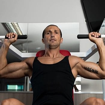 Using a machine for shoulder exercises