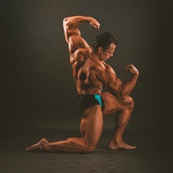 A bodybuilder with a Greek body flexing