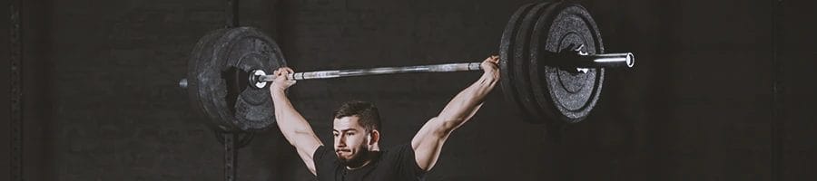 A person doing compound exercises for arms