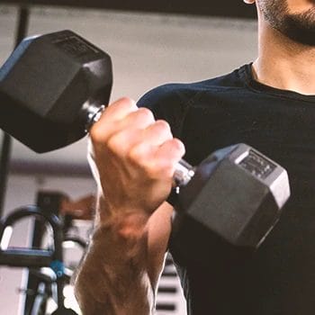 A person training biceps in the gym